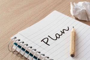 Writing your plans in a notebook